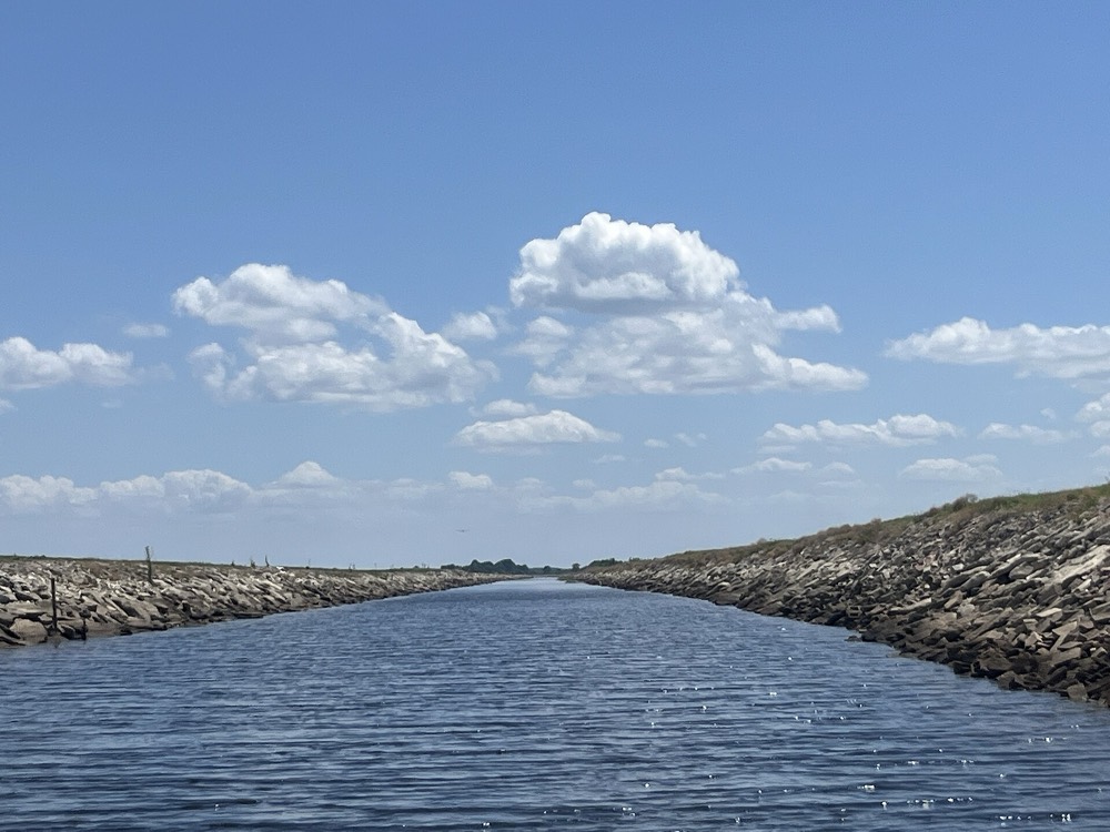 The St. Cloud Canal between its rock banks under a blue sky